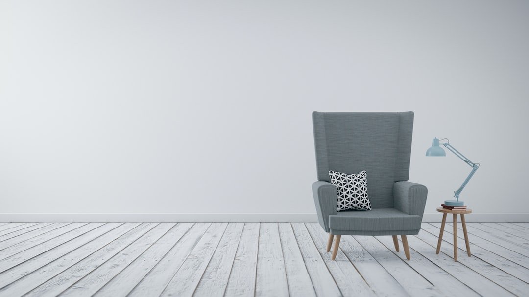 Armchair, cushion and side table with a lamp