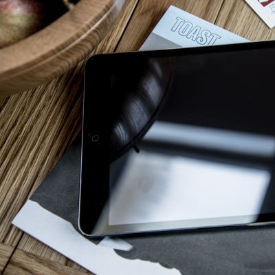 Tablet alongside a TOAST catalogue